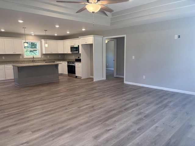 760 Hanestown Rd, Lafayette, TN 37083 - kitchen featuring appliances with stainless steel finishes, ceiling fan, recessed lighting, white cabinets, and open floor plan