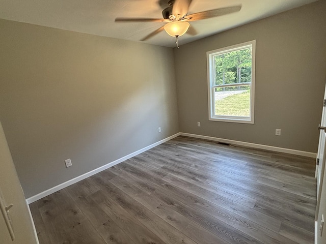 760 Hanestown Rd, Lafayette, TN 37083 - empty room with ceiling fan and dark wood-style flooring