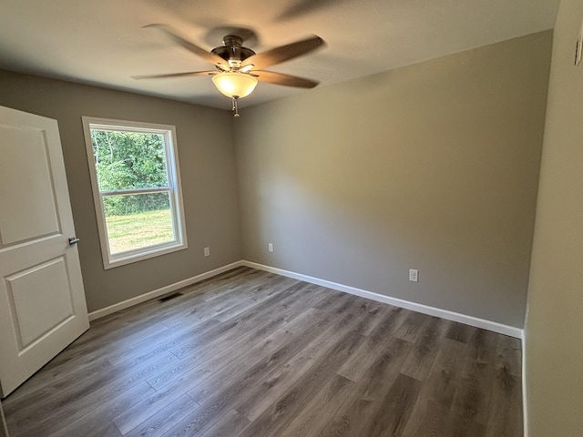 760 Hanestown Rd, Lafayette, TN 37083 - empty room with a ceiling fan and dark wood-style flooring