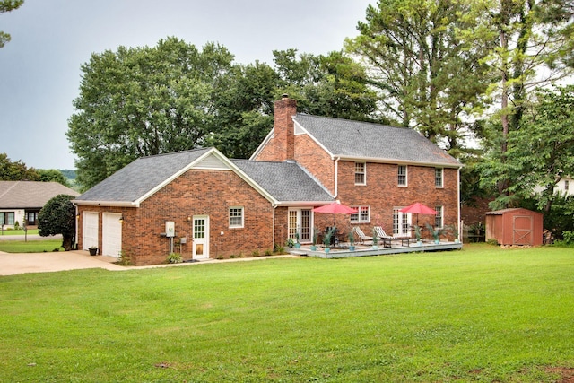 201 Stoneybrook Rd, Columbia, TN 38401 - rear view of property featuring a storage unit, a chimney, brick siding, and a lawn