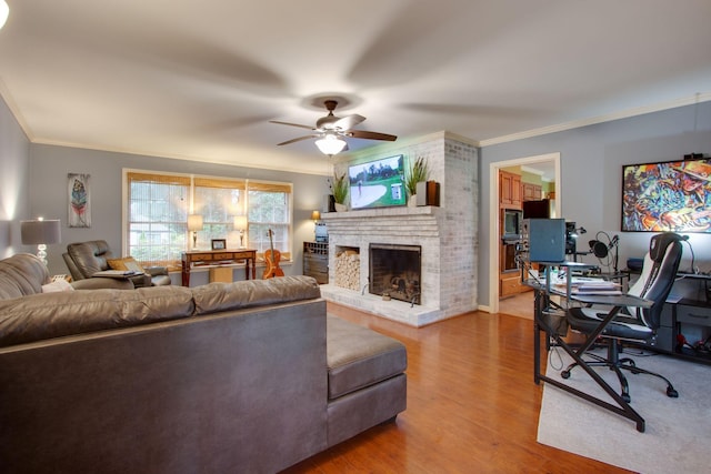 201 Stoneybrook Rd, Columbia, TN 38401 - living room with ornamental molding, a desk, a ceiling fan, a brick fireplace, and wood finished floors
