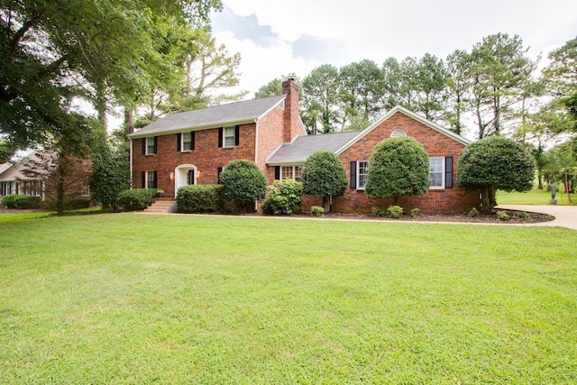 201 Stoneybrook Rd, Columbia, TN 38401 - colonial house with a chimney, a front yard, and brick siding