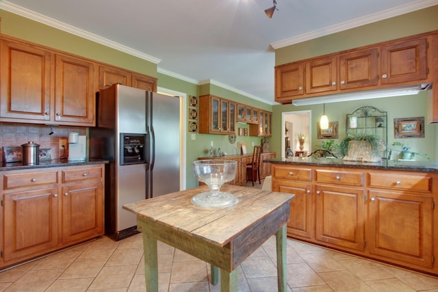 201 Stoneybrook Rd, Columbia, TN 38401 - kitchen featuring stainless steel fridge, brown cabinetry, light tile patterned floors, and crown molding