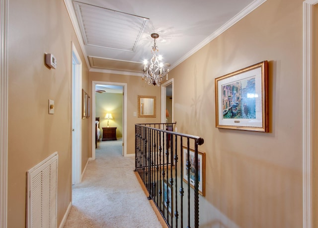 201 Stoneybrook Rd, Columbia, TN 38401 - corridor with an upstairs landing, light colored carpet, attic access, ornamental molding, and a chandelier