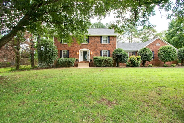 201 Stoneybrook Rd, Columbia, TN 38401 - colonial inspired home with a front yard, brick siding, and a shingled roof