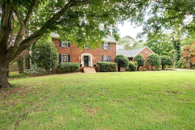 201 Stoneybrook Rd, Columbia, TN 38401 - colonial home with a front lawn, brick siding, and a chimney