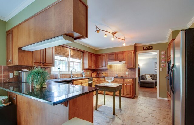 201 Stoneybrook Rd, Columbia, TN 38401 - kitchen with stainless steel fridge, a peninsula, decorative backsplash, crown molding, and under cabinet range hood