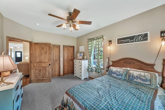 3534 Summertown Hwy, Summertown, TN 38483 - bedroom with light colored carpet, multiple windows, a ceiling fan, and two closets