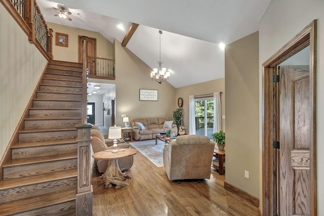 3534 Summertown Hwy, Summertown, TN 38483 - living area featuring wood finished floors, stairway, a chandelier, a ceiling fan, and high vaulted ceiling