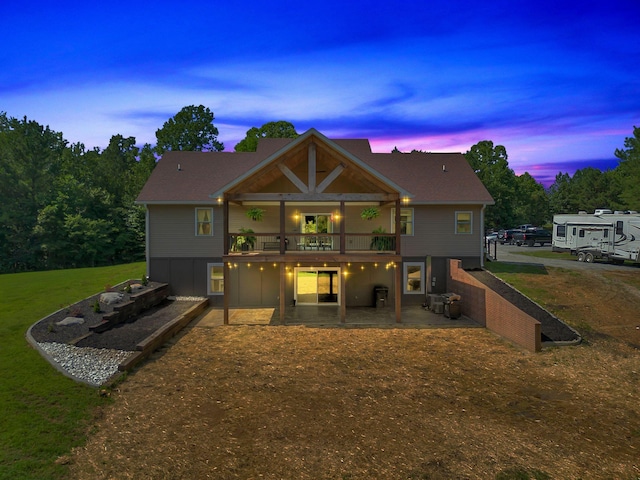 3534 Summertown Hwy, Summertown, TN 38483 - back of house at dusk with a patio area, a yard, and a wooden deck