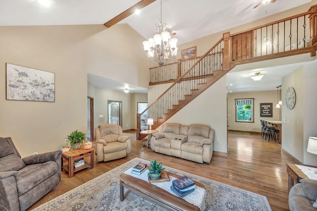 3534 Summertown Hwy, Summertown, TN 38483 - living room with light wood finished floors, stairway, beam ceiling, high vaulted ceiling, and a chandelier