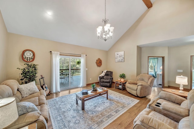 3534 Summertown Hwy, Summertown, TN 38483 - living area with high vaulted ceiling, light wood-type flooring, and a chandelier