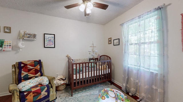 5131 Hunters Point Ln, Hermitage, TN 37076 - bedroom featuring a ceiling fan and a textured ceiling