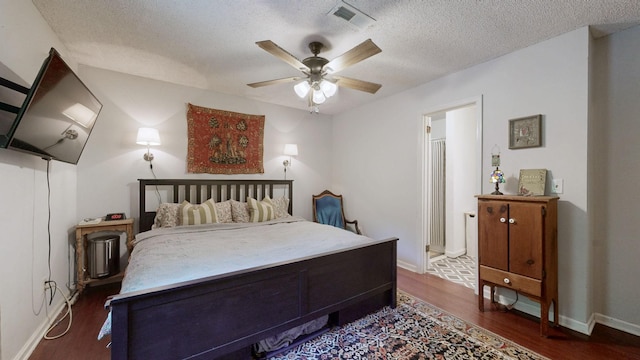 5131 Hunters Point Ln, Hermitage, TN 37076 - bedroom with dark wood-style floors, a textured ceiling, and a ceiling fan