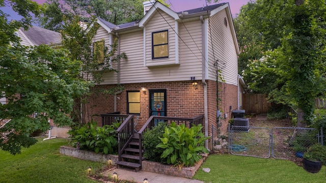 5131 Hunters Point Ln, Hermitage, TN 37076 - view of front facade featuring brick siding, a deck, and a gate