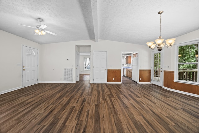 7125 Sutton Pl, Fairview, TN 37062 - unfurnished living room featuring dark wood-style flooring, a chandelier, a textured ceiling, a wainscoted wall, and a ceiling fan