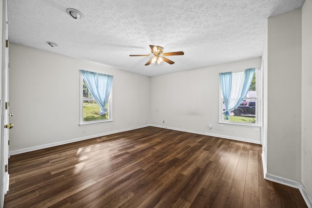 7125 Sutton Pl, Fairview, TN 37062 - spare room with dark wood-style flooring, a ceiling fan, and a textured ceiling