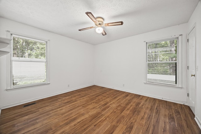 7125 Sutton Pl, Fairview, TN 37062 - empty room with wood finished floors, a ceiling fan, and a textured ceiling