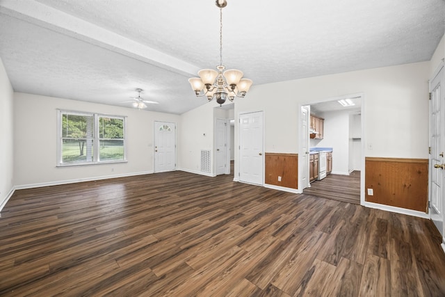 7125 Sutton Pl, Fairview, TN 37062 - unfurnished living room featuring a chandelier, dark wood-style floors, a ceiling fan, wainscoting, and a textured ceiling