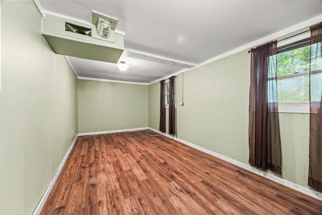 7125 Sutton Pl, Fairview, TN 37062 - empty room with wood finished floors and concrete block wall