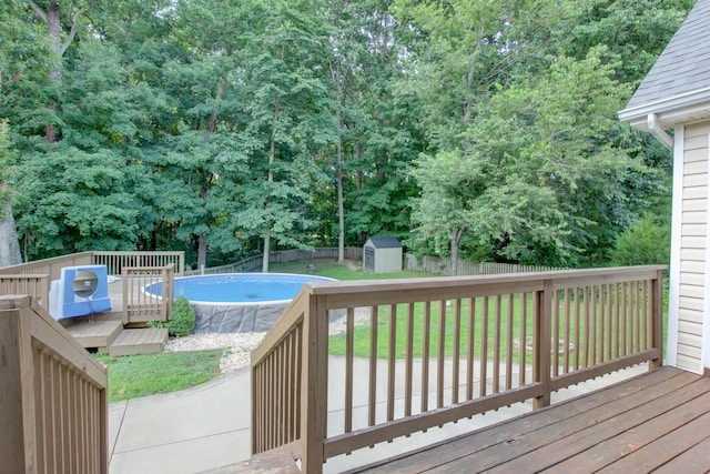 4425 Taylor Hall Ln, Adams, TN 37010 - wooden terrace with a storage unit, a fenced backyard, and an outdoor pool