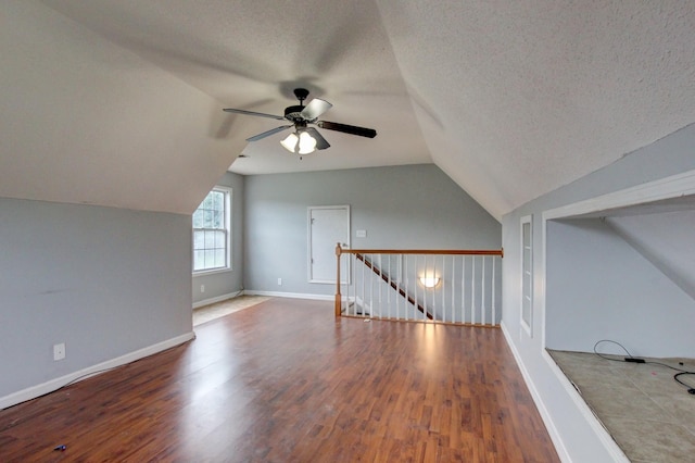 4425 Taylor Hall Ln, Adams, TN 37010 - additional living space with ceiling fan, lofted ceiling, wood finished floors, and a textured ceiling