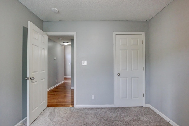 4425 Taylor Hall Ln, Adams, TN 37010 - unfurnished bedroom featuring carpet and a textured ceiling