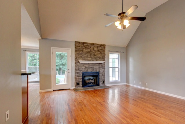 4425 Taylor Hall Ln, Adams, TN 37010 - unfurnished living room with high vaulted ceiling, light wood-style flooring, a ceiling fan, and a fireplace