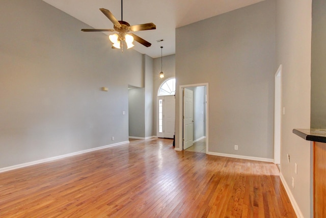 4425 Taylor Hall Ln, Adams, TN 37010 - unfurnished living room featuring high vaulted ceiling, a ceiling fan, and light wood finished floors
