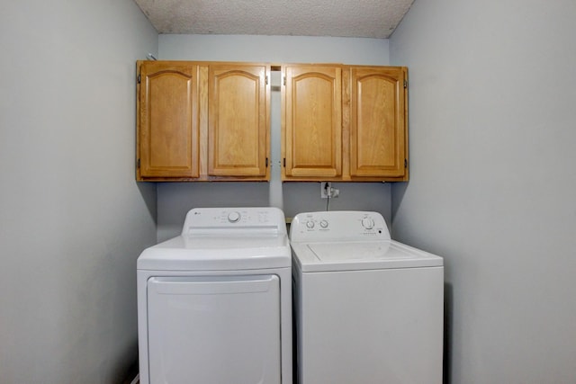 4425 Taylor Hall Ln, Adams, TN 37010 - laundry room featuring cabinet space, independent washer and dryer, and a textured ceiling