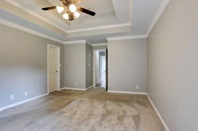 4425 Taylor Hall Ln, Adams, TN 37010 - spare room with a tray ceiling, a ceiling fan, carpet floors, and ornamental molding