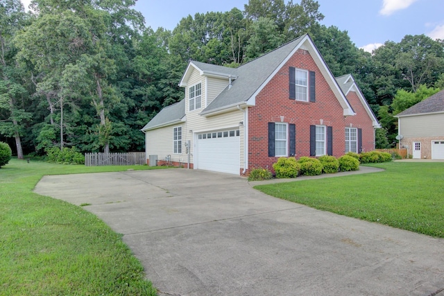 4425 Taylor Hall Ln, Adams, TN 37010 - view of front facade with driveway, brick siding, a garage, and roof with shingles