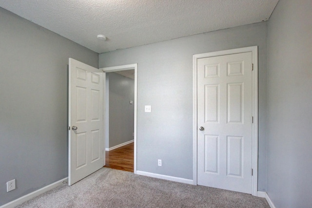 4425 Taylor Hall Ln, Adams, TN 37010 - unfurnished bedroom with carpet floors and a textured ceiling