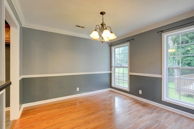 4425 Taylor Hall Ln, Adams, TN 37010 - empty room with a chandelier, light wood-style floors, and crown molding