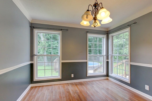 4425 Taylor Hall Ln, Adams, TN 37010 - unfurnished dining area with a chandelier, ornamental molding, wood finished floors, and healthy amount of natural light