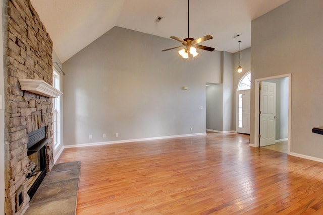 4425 Taylor Hall Ln, Adams, TN 37010 - unfurnished living room featuring high vaulted ceiling, a fireplace, a ceiling fan, and light wood-style floors