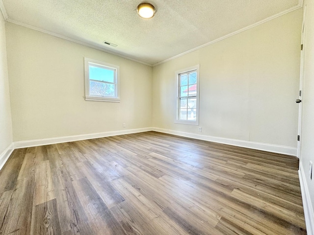 810 Roanoke Ave, Chattanooga, TN 37404 - unfurnished room featuring dark wood-type flooring, ornamental molding, and a textured ceiling
