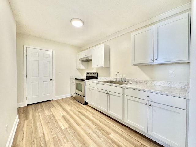 810 Roanoke Ave, Chattanooga, TN 37404 - kitchen with electric range, under cabinet range hood, light wood finished floors, white cabinets, and light stone counters