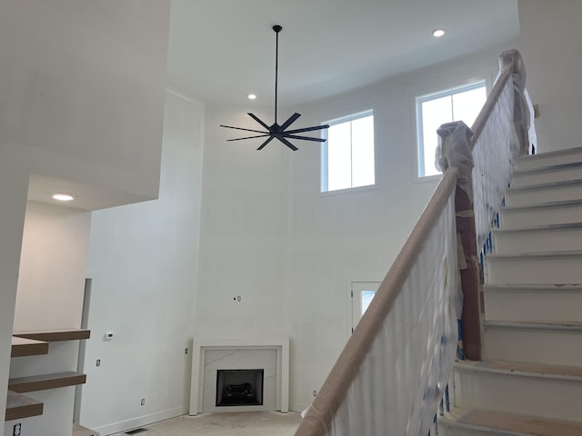 133 Scarsdale Dr S, Hendersonville, TN 37075 - stairs featuring a towering ceiling, a fireplace, recessed lighting, and a ceiling fan