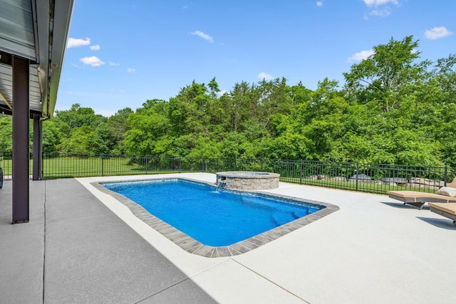 4934 Reynolds Rd, Columbia, TN 38401 - view of swimming pool with a patio, an in-ground hot tub, and a view of trees