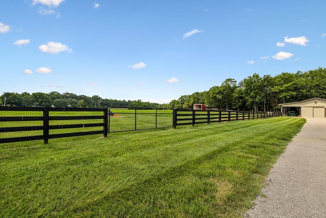 4934 Reynolds Rd, Columbia, TN 38401 - view of yard featuring a garage, an outbuilding, and a rural view