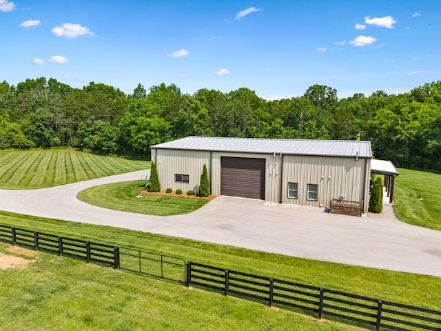 4934 Reynolds Rd, Columbia, TN 38401 - garage with concrete driveway and a view of trees