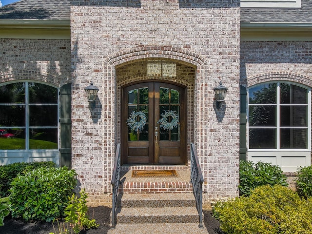 9516 Wicklow Rd, Brentwood, TN 37027 - view of exterior entry featuring french doors, brick siding, and roof with shingles