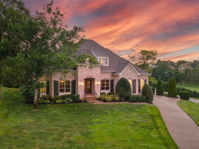 9516 Wicklow Rd, Brentwood, TN 37027 - french country style house featuring brick siding and a yard