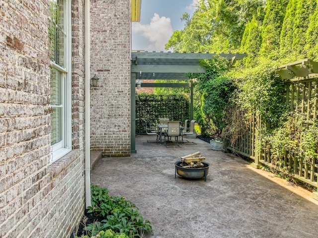 9516 Wicklow Rd, Brentwood, TN 37027 - view of patio featuring an outdoor fire pit, outdoor dining space, and a pergola