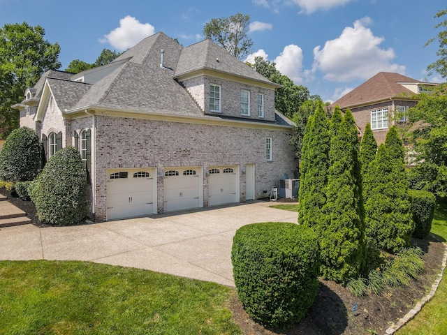 9516 Wicklow Rd, Brentwood, TN 37027 - view of property exterior featuring brick siding, driveway, and roof with shingles