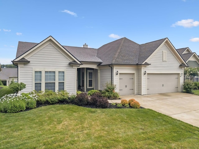 679 Overton Way, Spring Hill, TN 37174 - view of front of house featuring a garage, concrete driveway, a front lawn, and roof with shingles