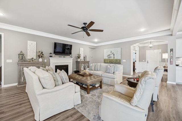 679 Overton Way, Spring Hill, TN 37174 - living room with arched walkways, wood finished floors, ceiling fan, ornamental molding, and recessed lighting