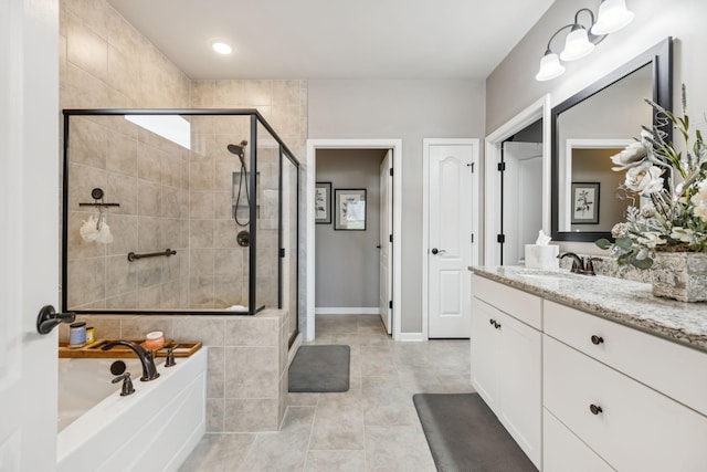 679 Overton Way, Spring Hill, TN 37174 - bathroom featuring vanity, a shower stall, a garden tub, and tile patterned flooring