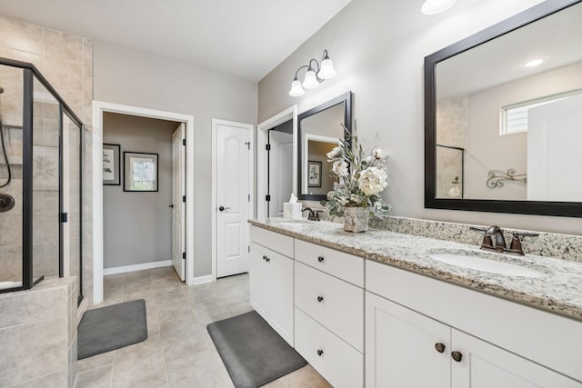 679 Overton Way, Spring Hill, TN 37174 - bathroom with a shower stall, double vanity, and tile patterned floors